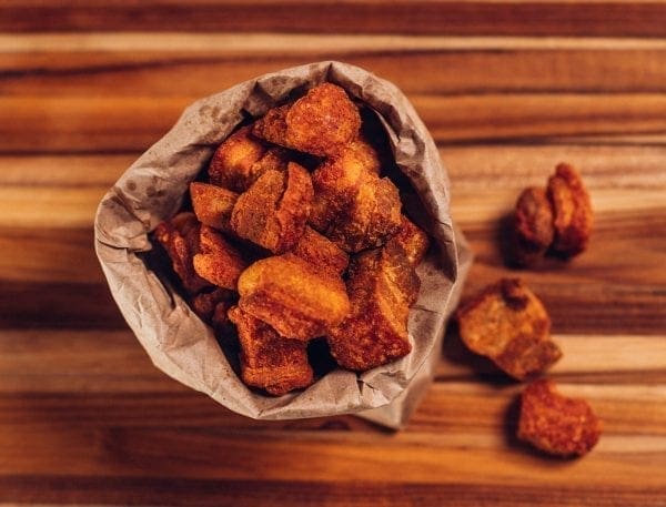 cracklins in a brown paper bag