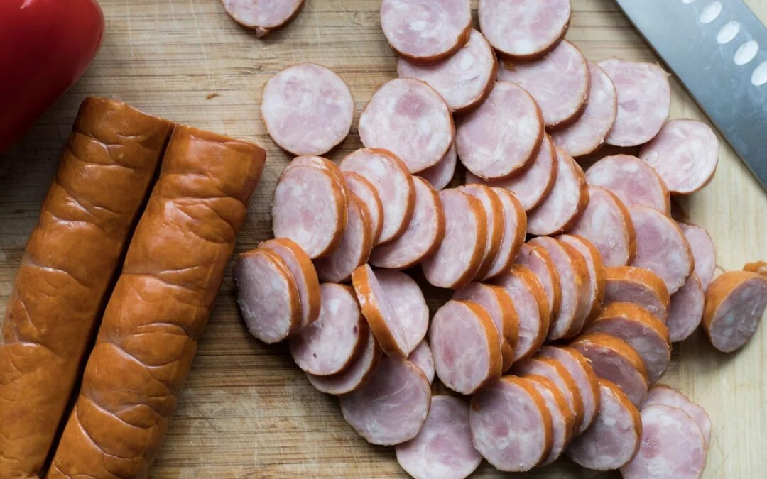 Netflix night snack spread with Cajun boudin, cracklins, and smoked sausage on a wooden board